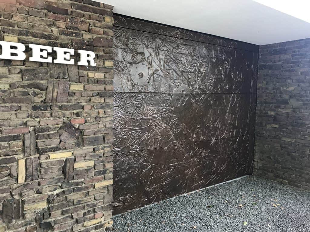 Garage door with VeroMetal Bronze black patina finish